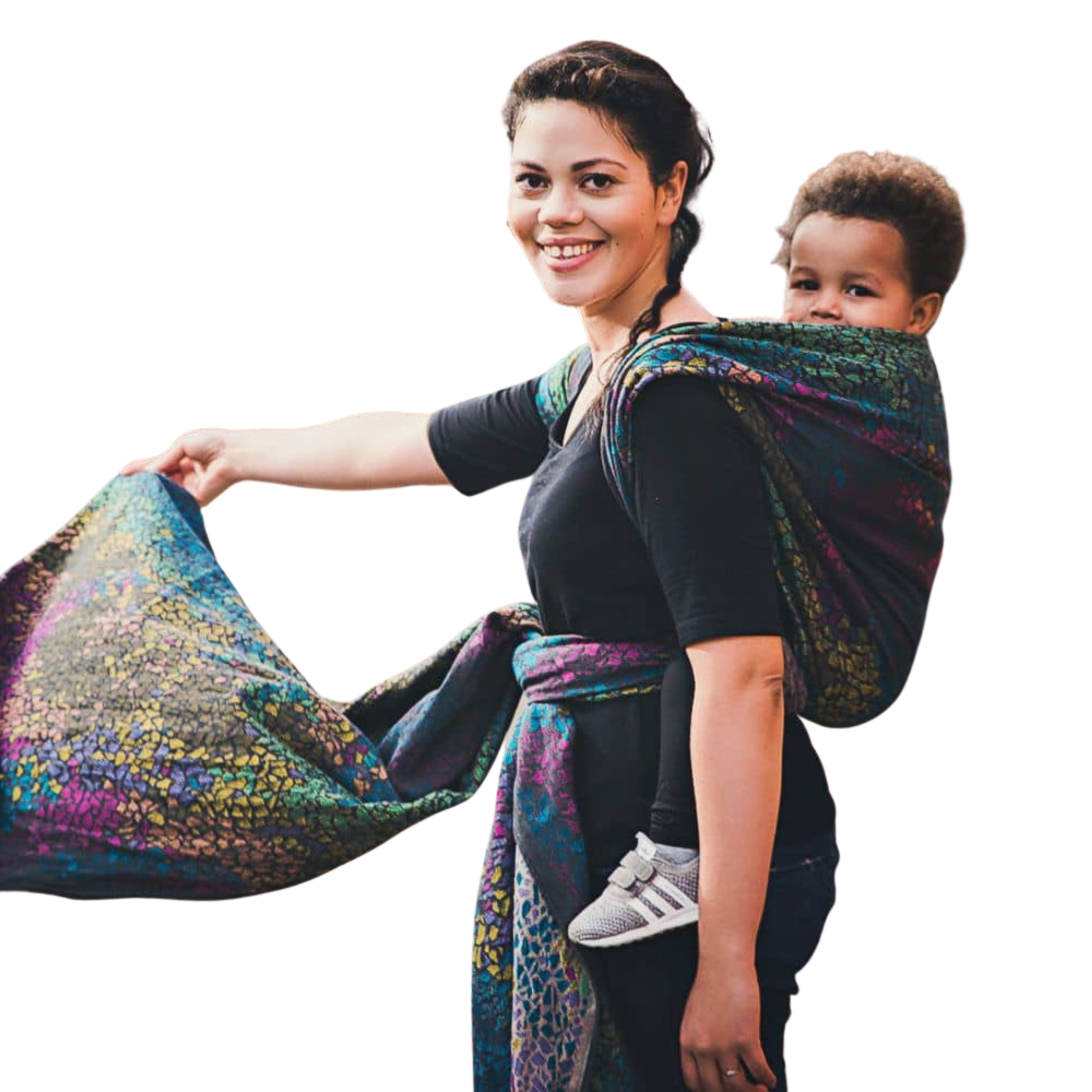 Woman wearing her son in a back carry in a  Didymos woven wrap, showcasing its intricate design, woven on traditional looms, and providing versatile, ergonomic baby carrier