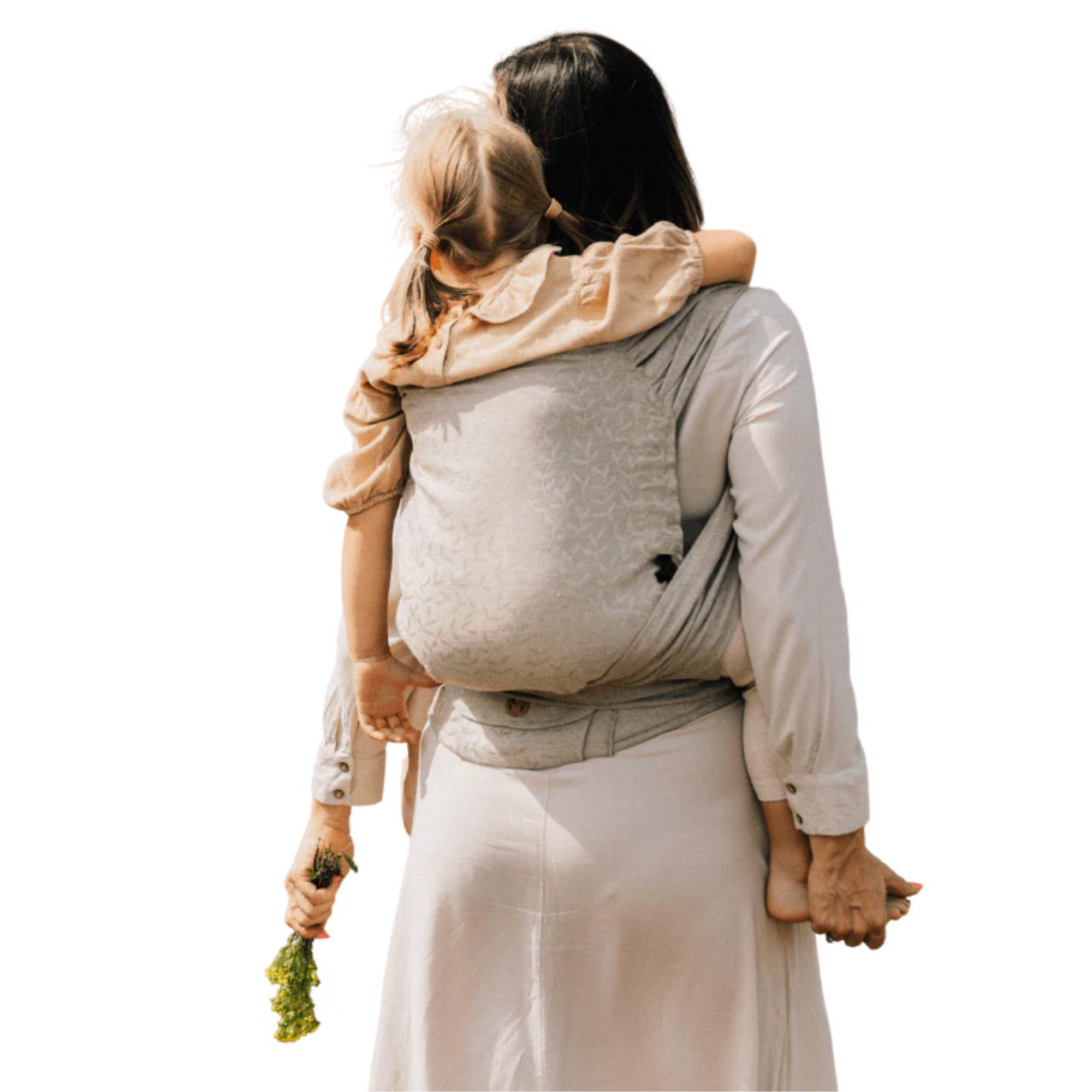 Mother wearing her child on her back in a preschool half buckle