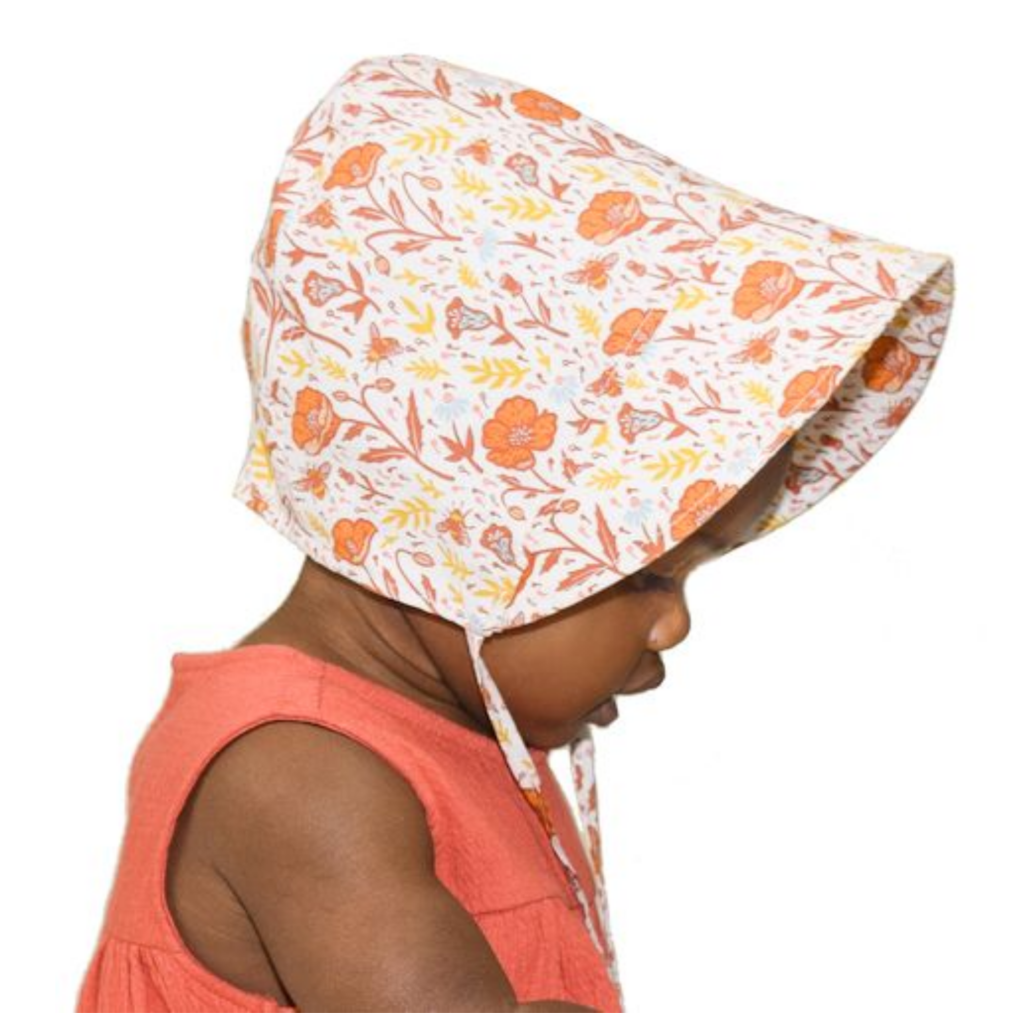 Child wearing a bonnet, made in canada offering stylish sun protection and comfort for outdoor adventures