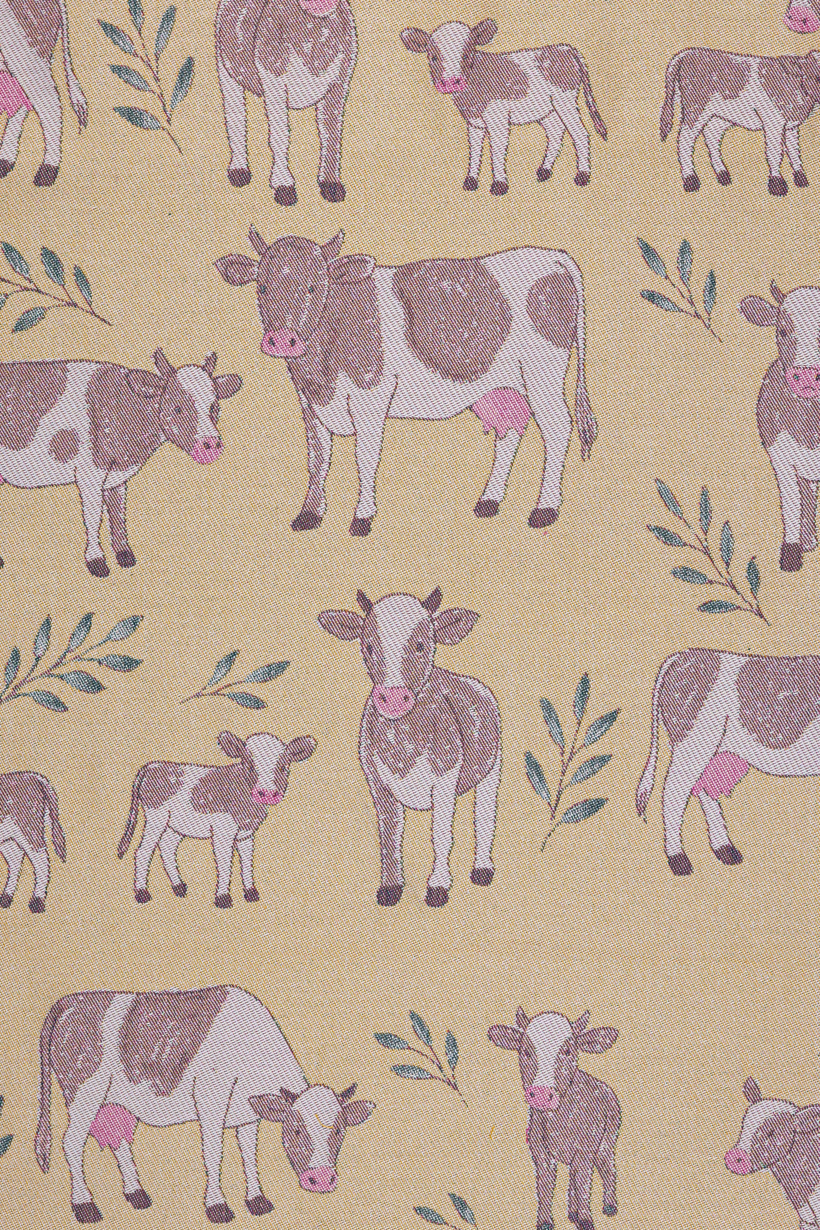 Pattern of cows and calves on a yellow beige background