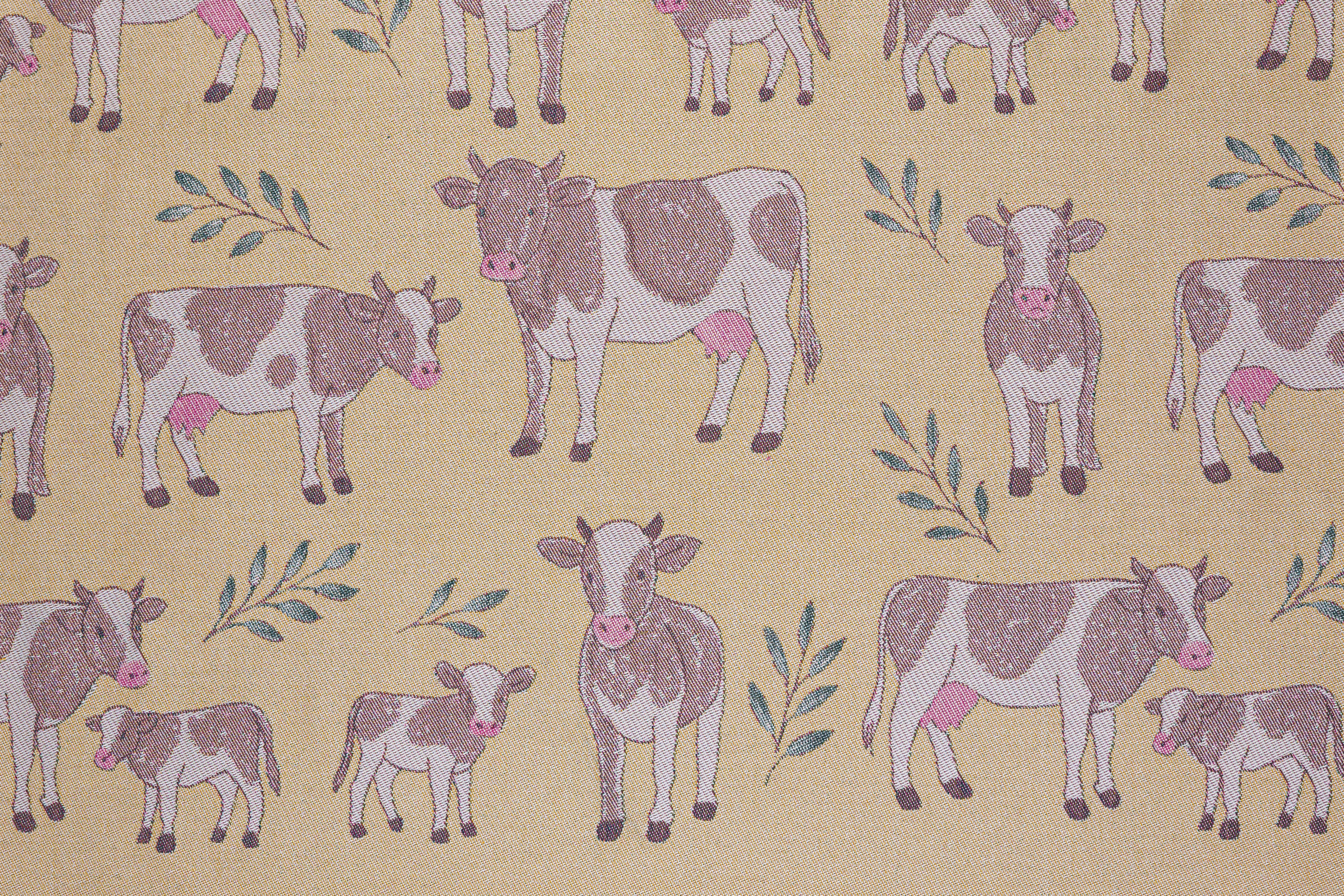 Pattern of cows and calves on a yellow beige background
