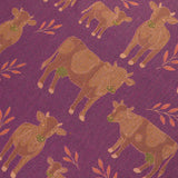 Pattern of brown cows with green tags on a purple background