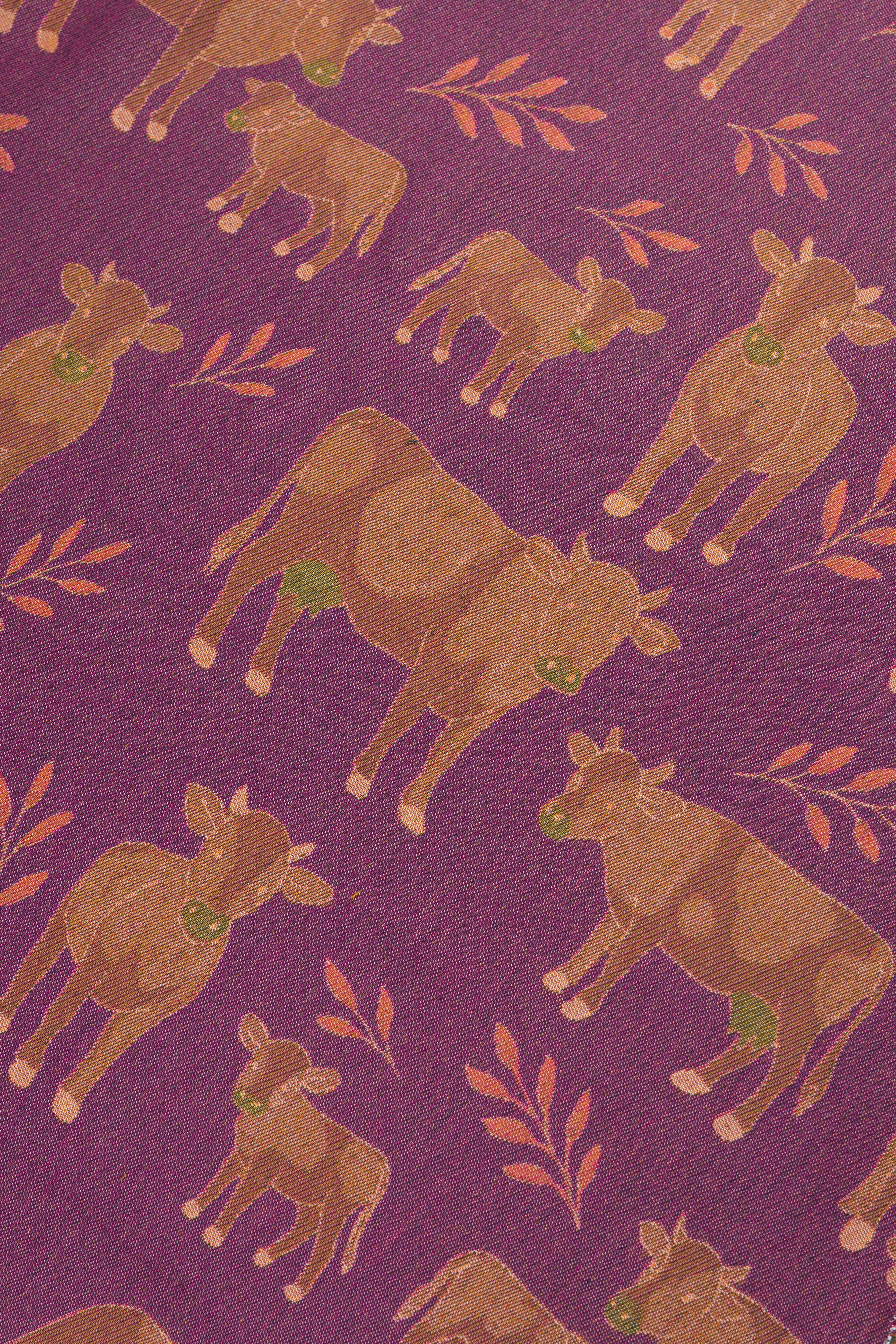 Pattern of brown cows with green tags on a purple background