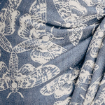 Pattern of white butterflies on a blue background