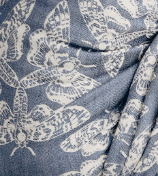 Pattern of white butterflies on a blue background