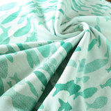Swirling Fishes Emerald Half linen Blanket by Didymos Didymos