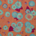 Decorative pattern with orange silhouettes of figures and foliage and skulls on a blue background