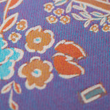 Floral and decorative pattern with dog illustrations on a purple background