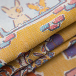 Floral and decorative pattern with dog illustrations on a yellow background