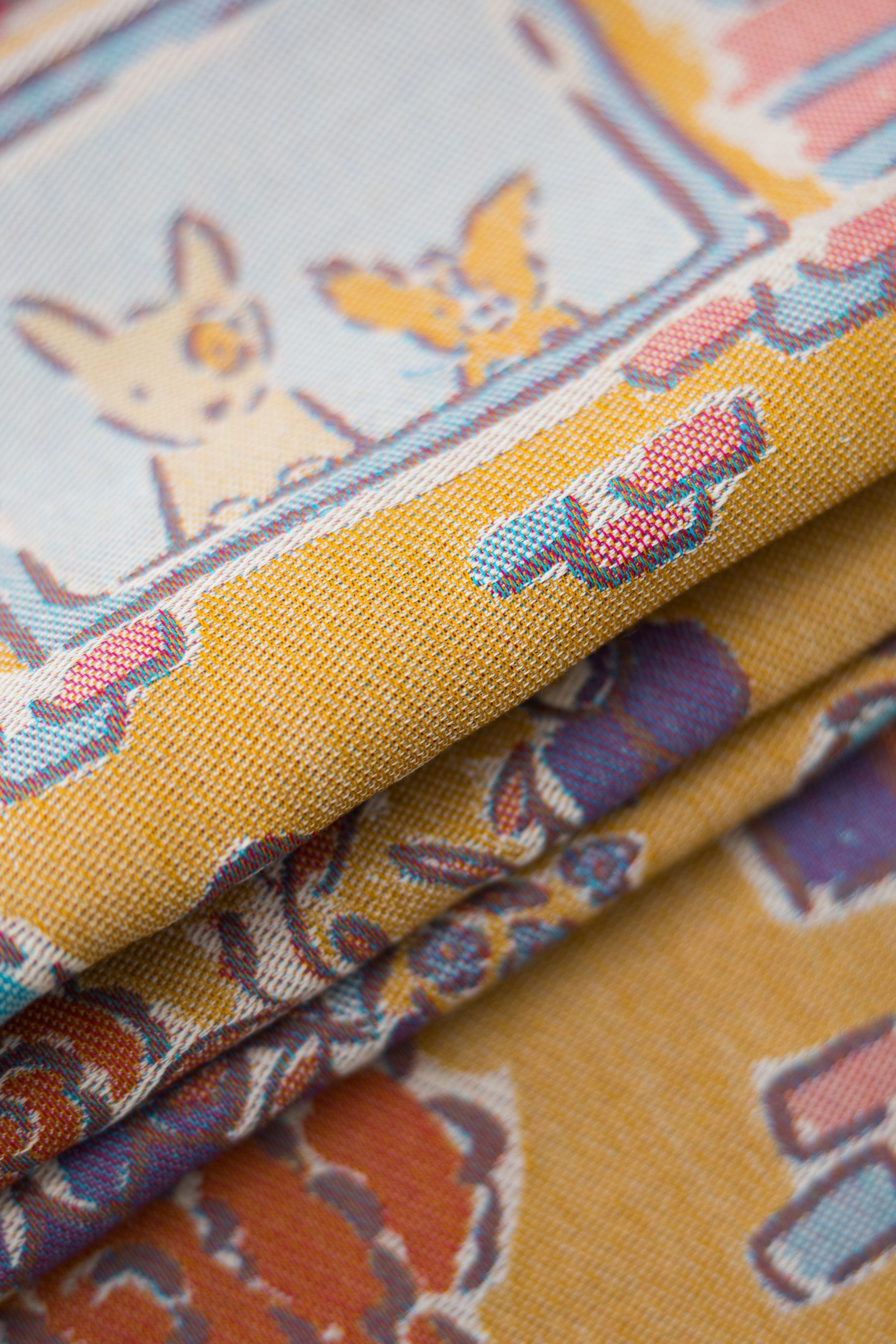 Floral and decorative pattern with dog illustrations on a yellow background