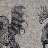 Close-up of a woven textile pattern featuring black and white dragon  antasy creature illustrations on a white background.