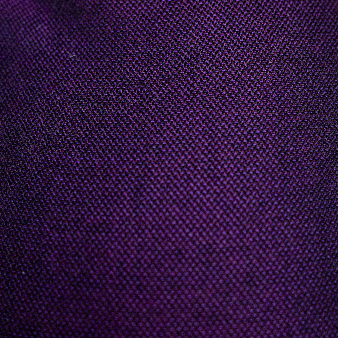 Close-up of a textured purple fabric surface