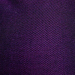Close-up of a textured purple fabric surface