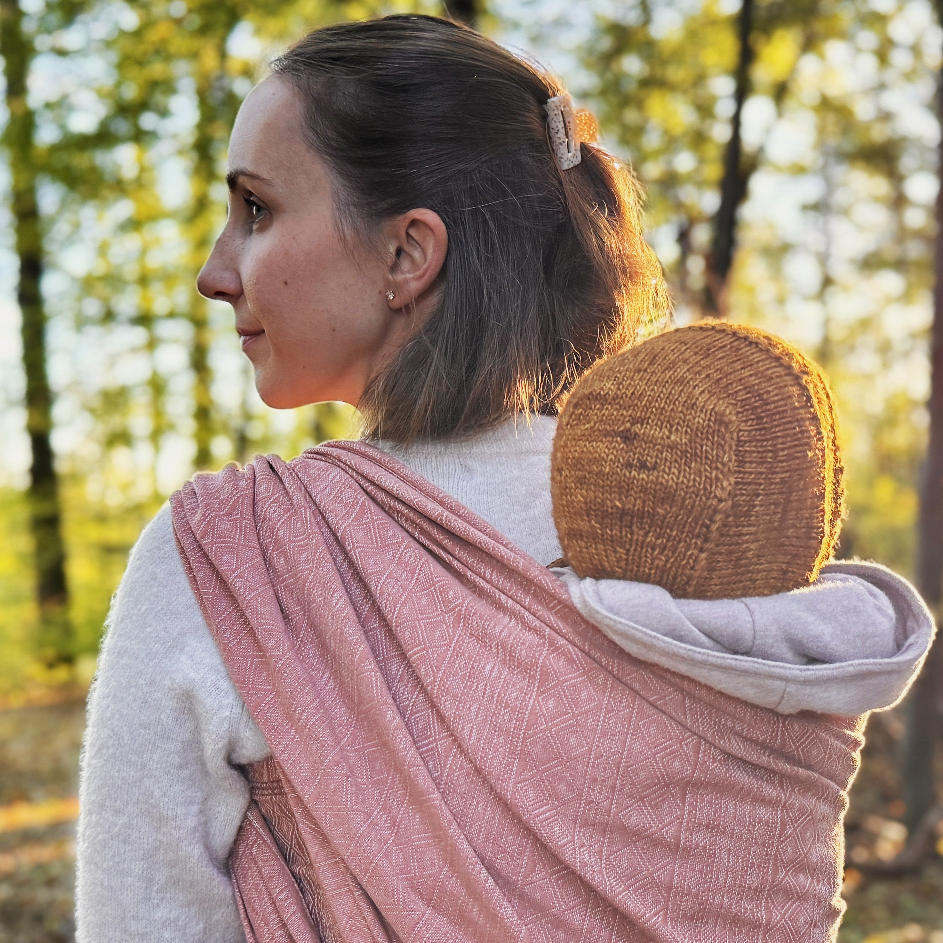 Prima Rosewood Woven Wrap by Didymos, back carry outdoors in autumn woods