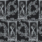 Decorative pattern with white silhouettes of figures and foliage and skulls on a black background